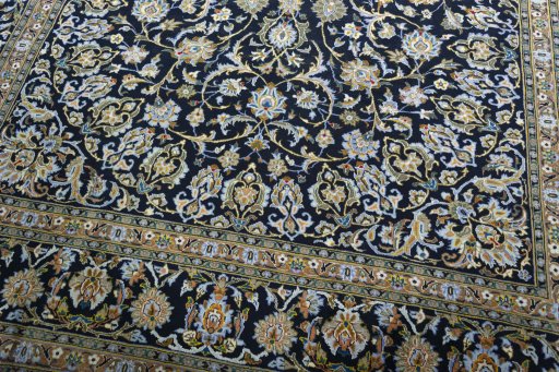 Close-up detail of 2000s Kashan rug from Iran / Persia showing Wool weave