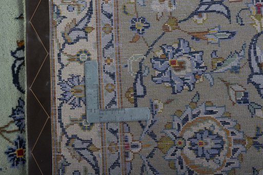 Backside of handmade 1970s Kashan rug showing knot structure and weave density