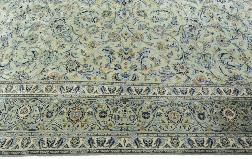 Corner detail of 1970s Kashan rug showing border pattern and Wool pile
