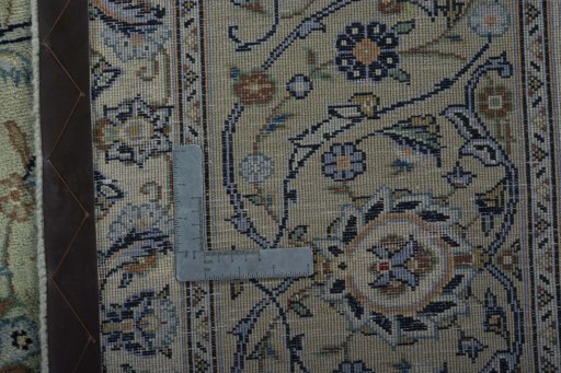 Backside of handmade 1970s Kashan rug showing knot structure and weave density