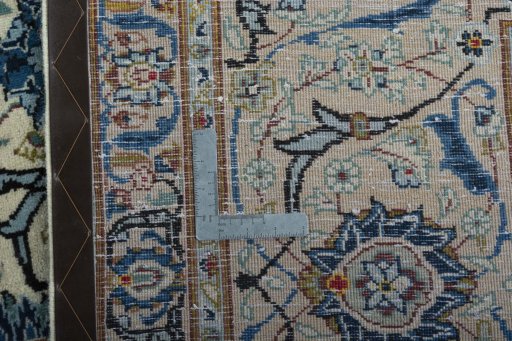 Backside of handmade 2000s Kashan rug showing knot structure and weave density