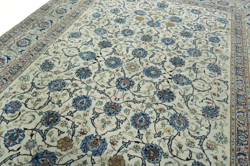 Backside of handmade 2000s Kashan rug showing knot structure and weave density