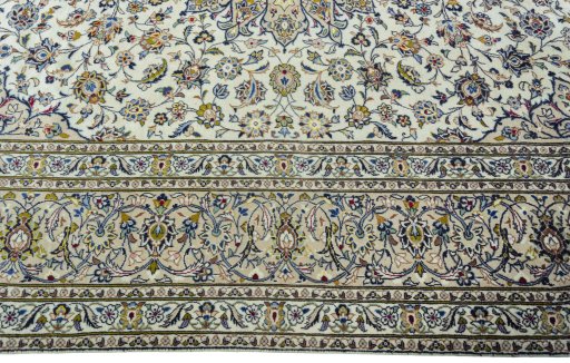 Corner detail of 2000s Kashan rug showing border pattern and Wool pile