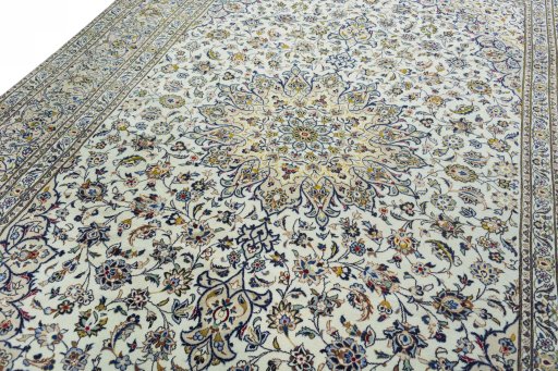 Backside of handmade 2000s Kashan rug showing knot structure and weave density