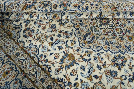 Close-up detail of 2000s Kashan rug from Iran / Persia showing Wool weave