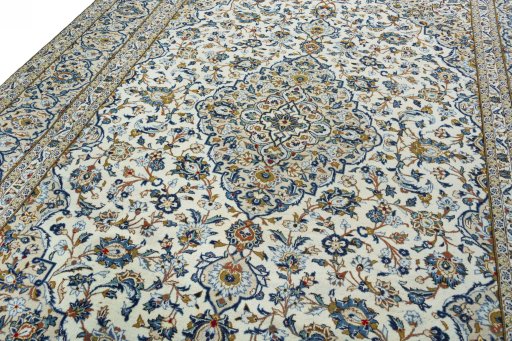 Backside of handmade 2000s Kashan rug showing knot structure and weave density