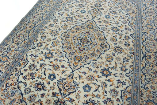Backside of handmade 2000s Kashan rug showing knot structure and weave density