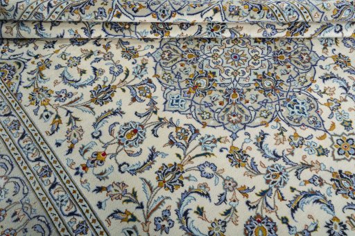 Close-up detail of 2000s Kashan rug from Iran / Persia showing Wool weave