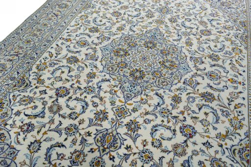Backside of handmade 2000s Kashan rug showing knot structure and weave density