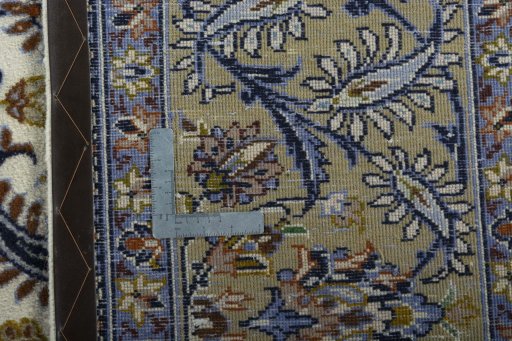 Backside of handmade 1970s Kashan rug showing knot structure and weave density