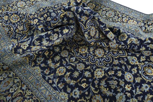 Surface texture of 2000s Kashan rug with natural Wool and intricate pattern