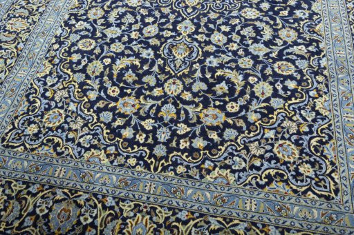 Close-up detail of 2000s Kashan rug from Iran / Persia showing Wool weave