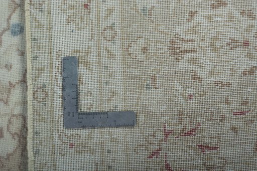 Backside of handmade 1970s Kashan rug showing knot structure and weave density