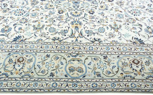 Corner detail of 2000s Kashan rug showing border pattern and Wool pile