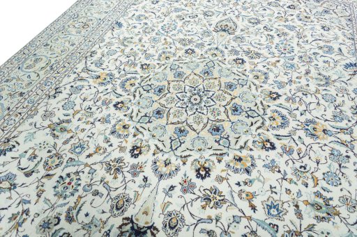 Backside of handmade 2000s Kashan rug showing knot structure and weave density