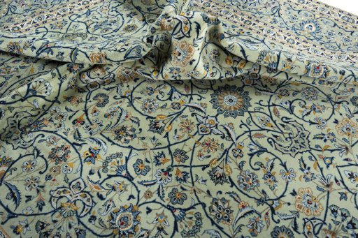 Surface texture of 2000s Kashan rug with natural Wool and intricate pattern