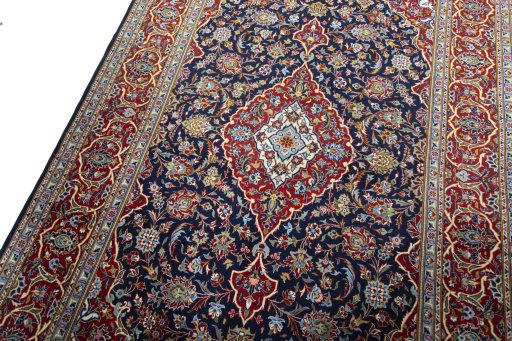 Backside of handmade New Kashan rug showing knot structure and weave density