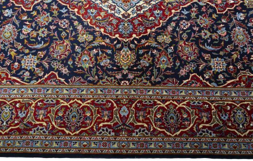 Corner detail of New Kashan rug showing border pattern and Cork pile