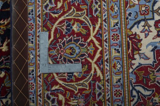 Backside of handmade New Kashan rug showing knot structure and weave density