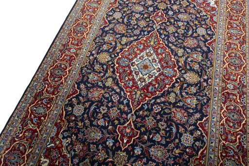 Backside of handmade New Kashan rug showing knot structure and weave density