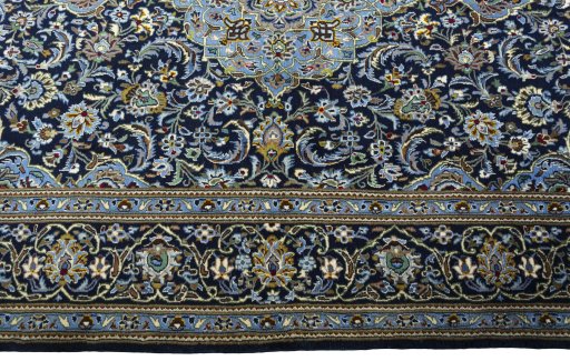 Corner detail of New Kashan rug showing border pattern and Cork pile