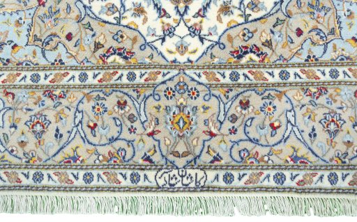 Corner detail of New Kashan rug showing border pattern and Cork pile