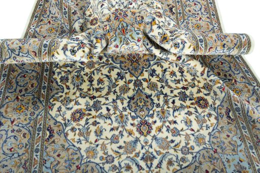 Backside of handmade New Kashan rug showing knot structure and weave density