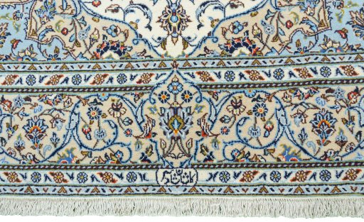Corner detail of New Kashan rug showing border pattern and Cork pile