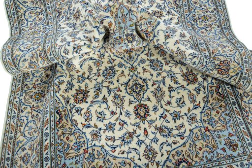 Backside of handmade New Kashan rug showing knot structure and weave density
