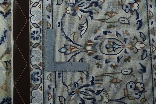 Backside of handmade 2000s Kashan rug showing knot structure and weave density