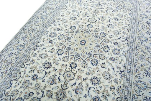 Backside of handmade 2000s Kashan rug showing knot structure and weave density
