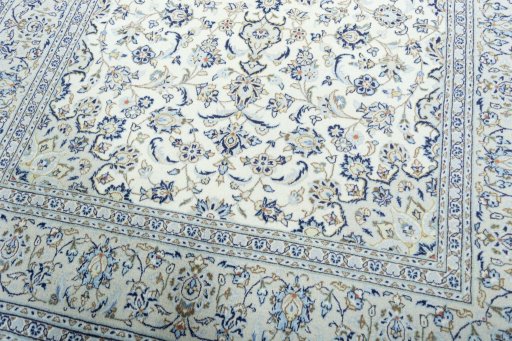 Close-up detail of 2000s Kashan rug from Iran / Persia showing Wool weave