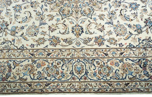 Corner detail of New Kashan rug showing border pattern and Wool pile