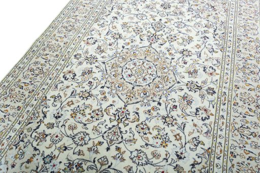 Backside of handmade 2000s Kashan rug showing knot structure and weave density