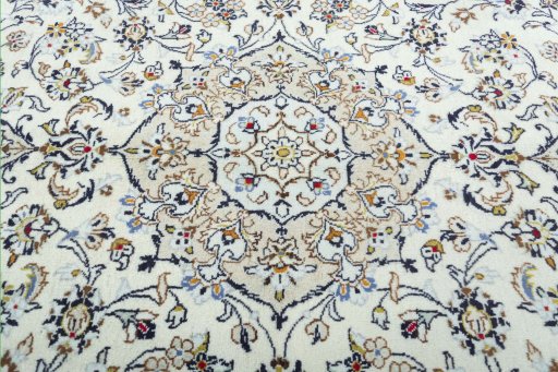 Central medallion detail of 2000s Kashan rug from Iran / Persia