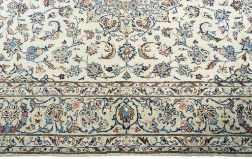 Corner detail of New Kashan rug showing border pattern and Wool pile