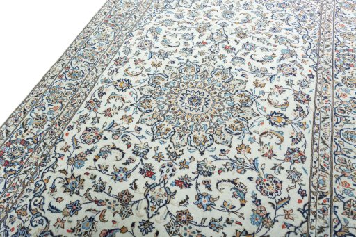 Backside of handmade 2000s Kashan rug showing knot structure and weave density