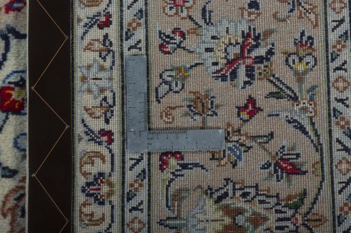 Backside of handmade New Kashan rug showing knot structure and weave density