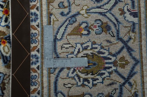 Backside of handmade 2000s Kashan rug showing knot structure and weave density