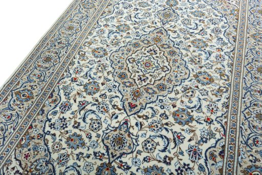 Backside of handmade 2000s Kashan rug showing knot structure and weave density