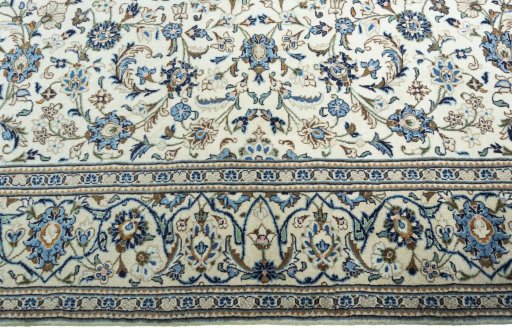 Corner detail of New Kashan rug showing border pattern and Wool pile