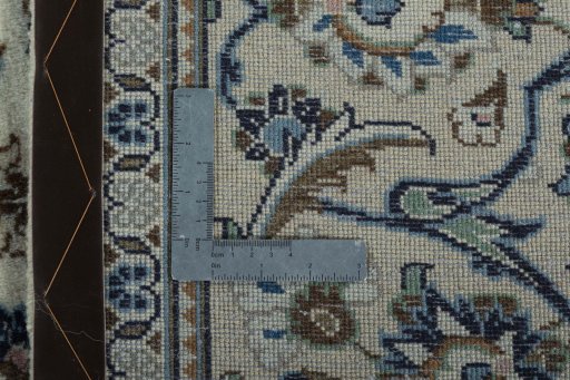 Backside of handmade New Kashan rug showing knot structure and weave density