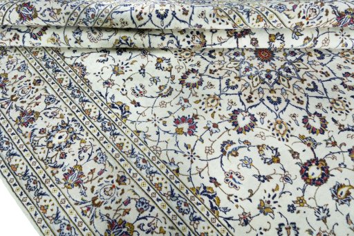 Close-up detail of 2000s Kashan rug from Iran / Persia showing Wool weave