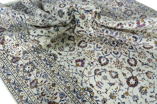 Surface texture of 2000s Kashan rug with natural Wool and intricate pattern