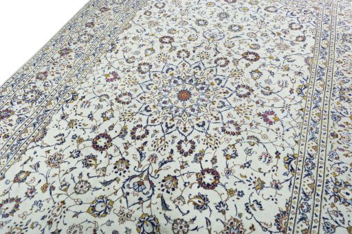 Backside of handmade 2000s Kashan rug showing knot structure and weave density
