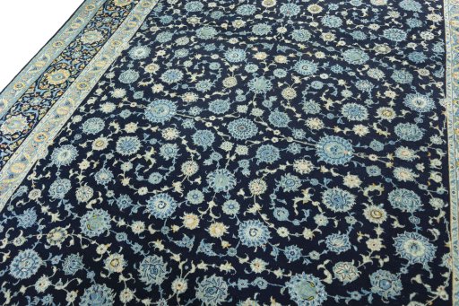 Backside of handmade 1970s Kashan rug showing knot structure and weave density