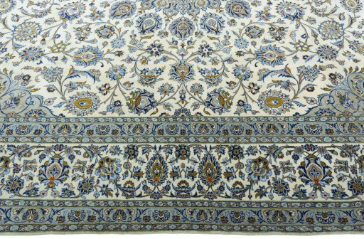 Corner detail of New Kashan rug showing border pattern and Cork pile