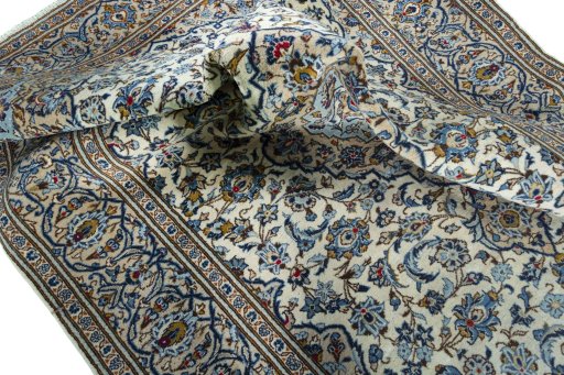Surface texture of 2000s Kashan rug with natural Wool and intricate pattern