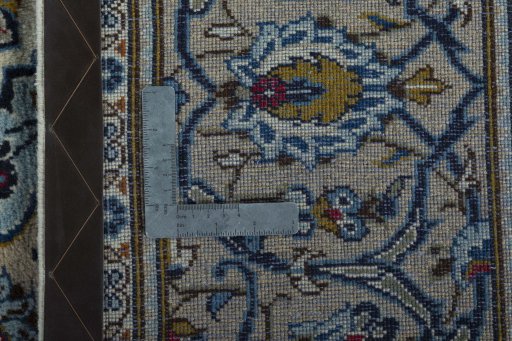 Backside of handmade 2000s Kashan rug showing knot structure and weave density