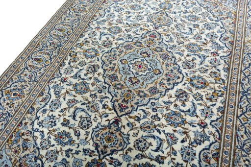 Backside of handmade 2000s Kashan rug showing knot structure and weave density